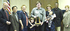 Group photo with Michael Laharty holding trophy