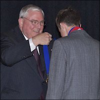 Dave Gordon presenting medal