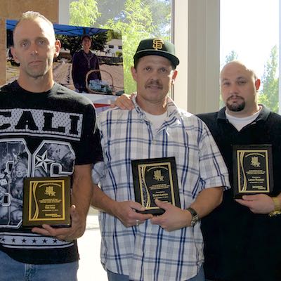 Honorees holding plaques