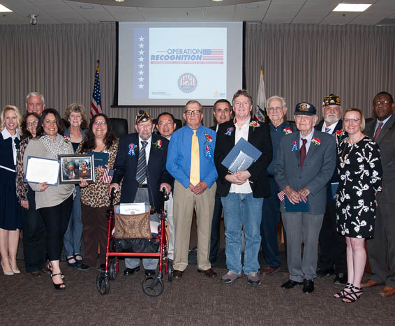 Diploma recipients posing with Board of Education