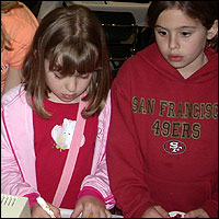 Students drawing with markers