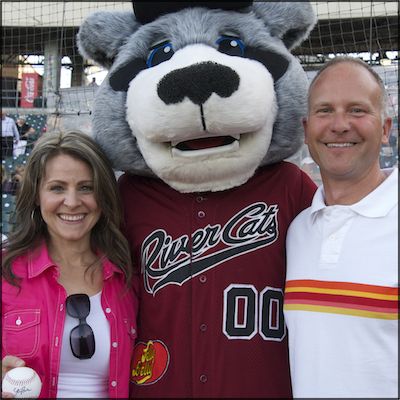 Jennifer Ellerman and Bob Crongeyer posing with River Cats mascot