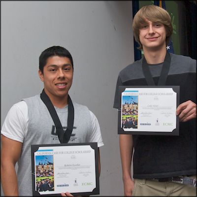 Students wearing medals and holding certificates