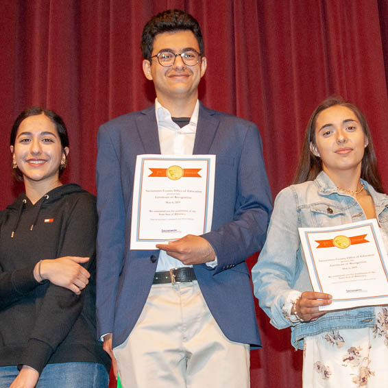 Students holding certificates