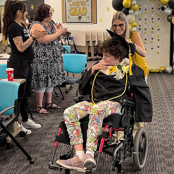 Student using wheelchair entering room