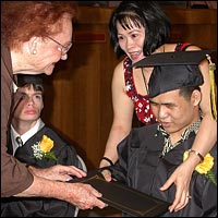 Graduate receiving his diploma