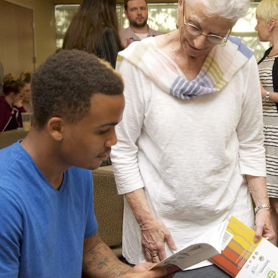 Student holding with author