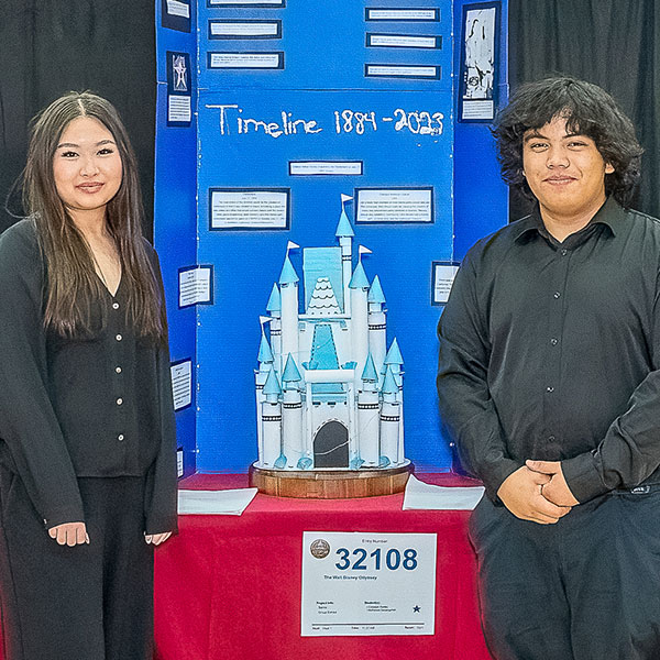 Students posing with project