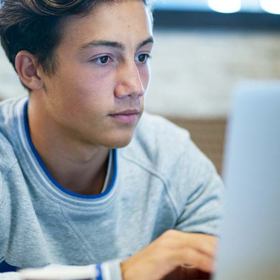 Student watching video on laptop
