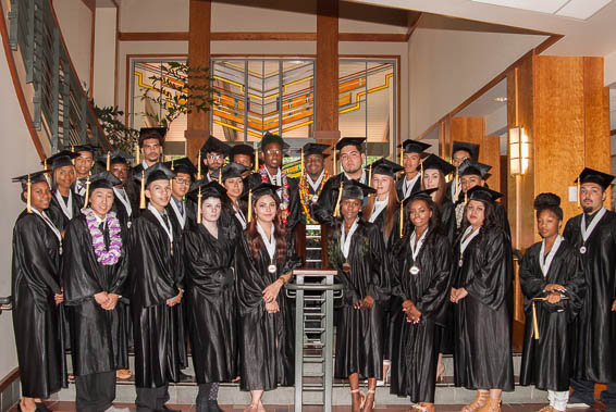 Graduates posing on stairs