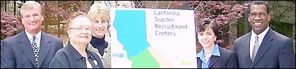 Representatives standing next to map of recruitment center regions