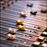 Close-up of mixer sliders and buttons