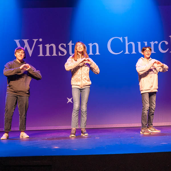 Students lip syncing on stage