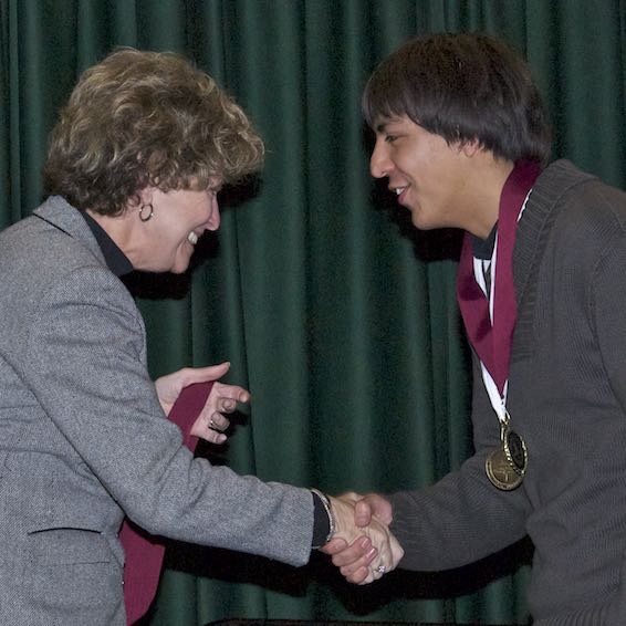 Student receiving medal