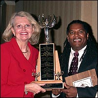 Barbara Harris and Asa L. Salley holding large trophy