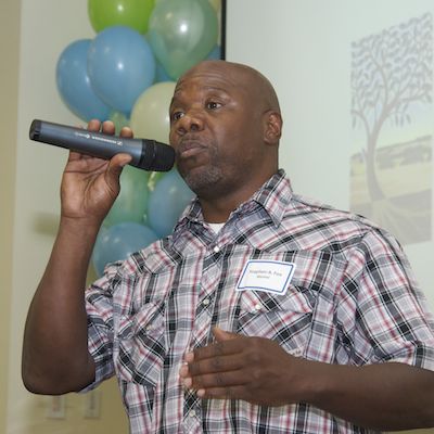 Stephen Fox speaking into microphone