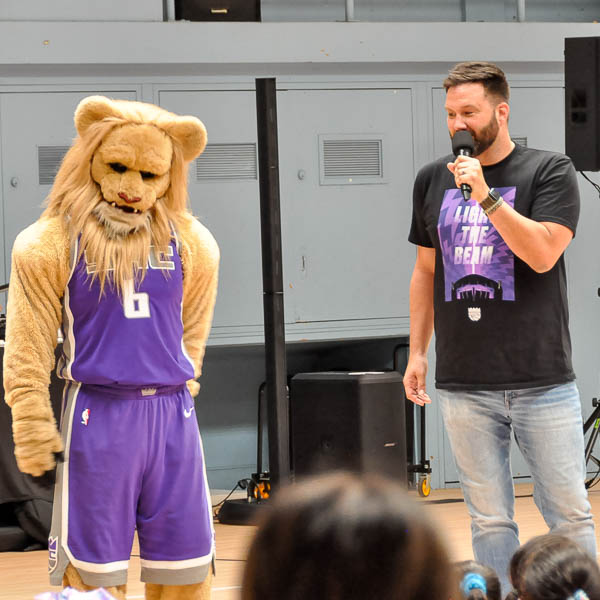 Scott Freshour and Slamson standing in front of students