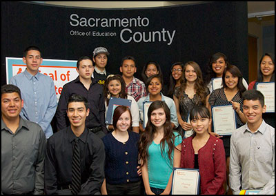 Students posing with certificates