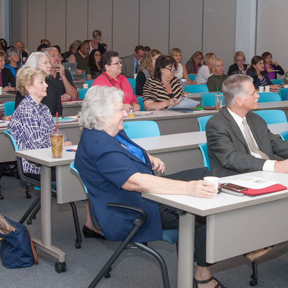 Meeting attendees seated at tables