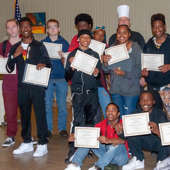 Group of students holding certificates