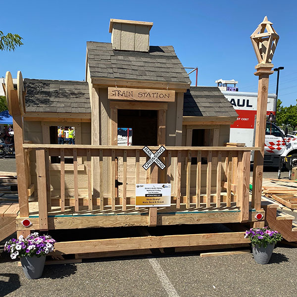 Wooden train station with a porch and streetlight