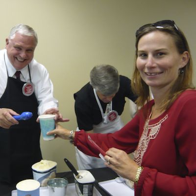 Superintendent serving root beer floats for staff
