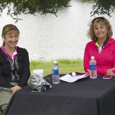 Staff seated at table on golf course