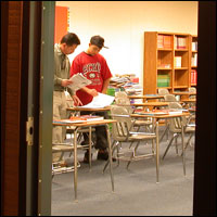 Parent and student seen through open classroom door