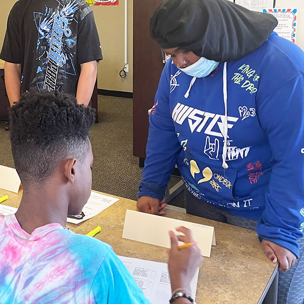 Student checking in to vote