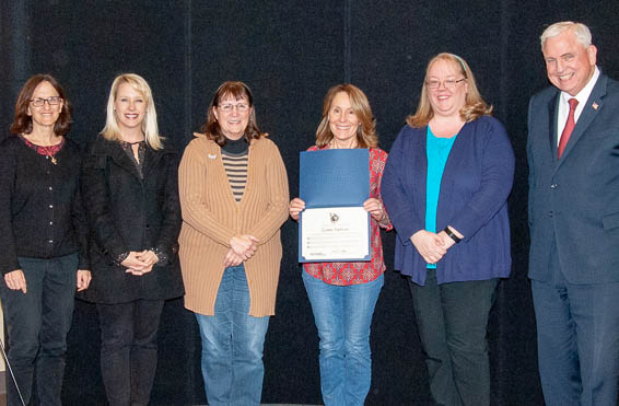 Connie Zastrow posing with dignitaries