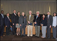 Diploma recipients posing with County Board of Education