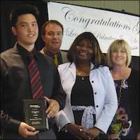 Student receiving plaque