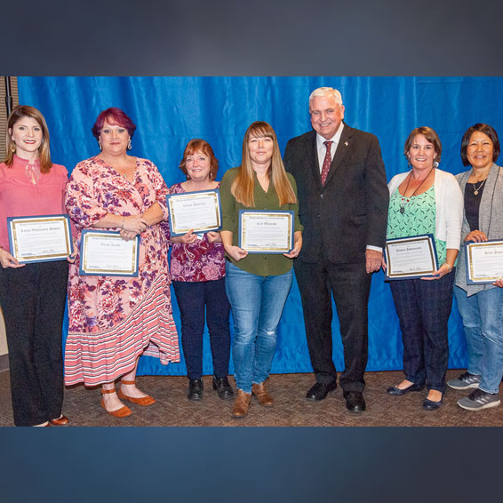 Classified Employee of the Year nominees, posed with superintendent, holding certificates