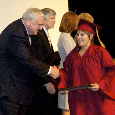 Client shaking hands while receiving certificate