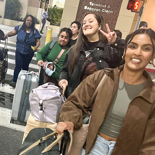 Clinicians walking to the airport with bags