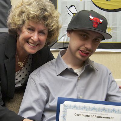 Jacquelyn Levy presenting certificate to graduate