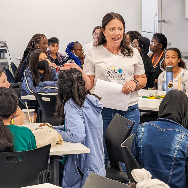 Presenter talking to students