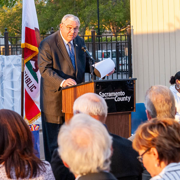 David W. Gordon speaking at podium