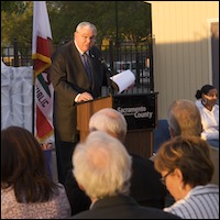 David W. Gordon speaking at podium