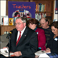 Superintendent speaking at microphone