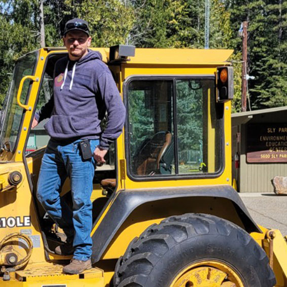 James Wagnon standing in door of tractor