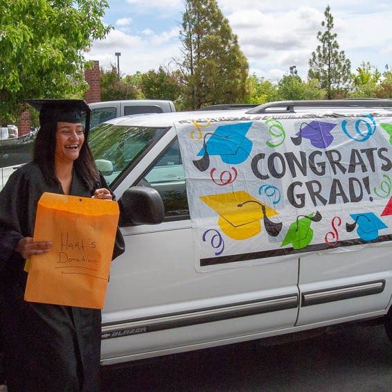 Cynthia McGhee standing in front of donated Chevy Blazer