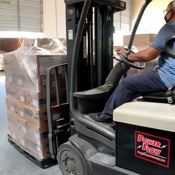 Forklift moving pallet of supplies