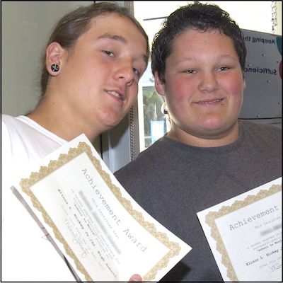 Students holding certificates