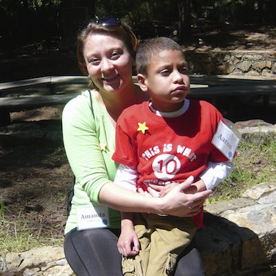 Parent hugging student