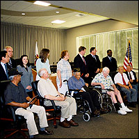 Operation Recognition diploma recipients posing with Board trustees and superintendent