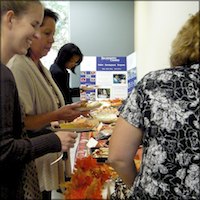 Employees eating pie