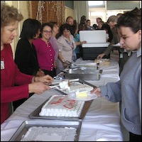 Staff member serving cake