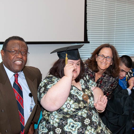 Graduates posing with Board trustees