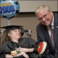 Superintendent posing with student